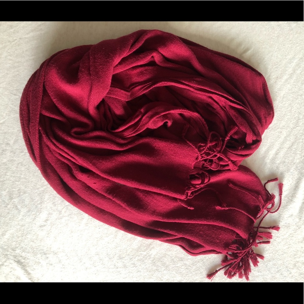 Deep red scarf with fringe detail